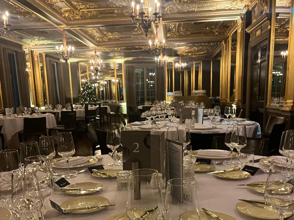 A private dining room laid for a corporate dinner